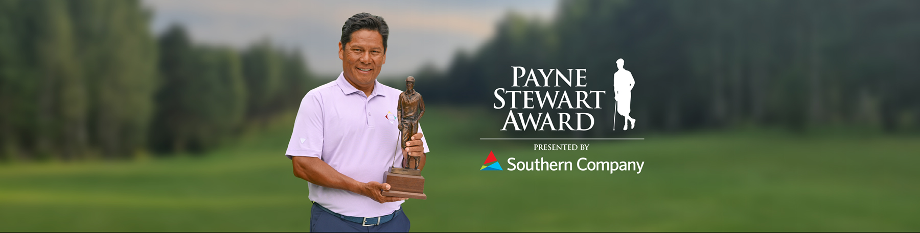 Notah Begay III posing with Payne Stewart Award trophy